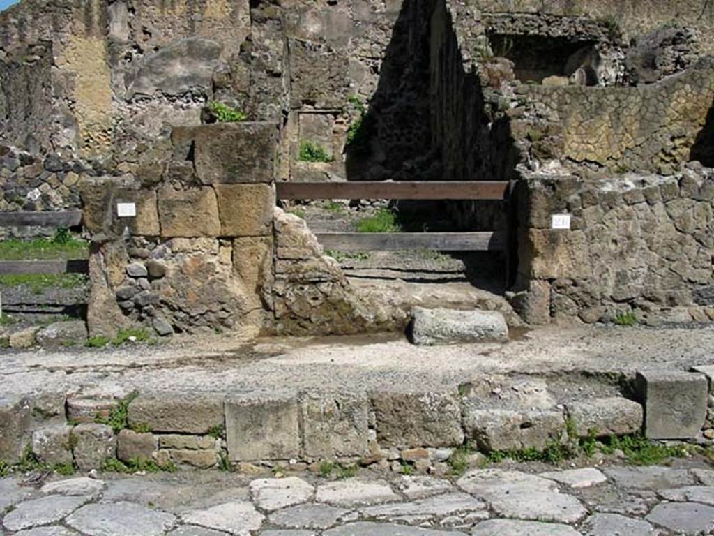 V.26, Herculaneum. May 2003. Looking west to entrance doorway on Cardo V.
Photo courtesy of Nicolas Monteix.